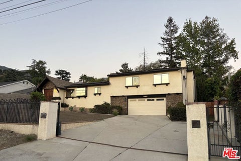 Photo of 10330 Marcus Avenue, Los Angeles, CA 91042 (MLS # 26985255)