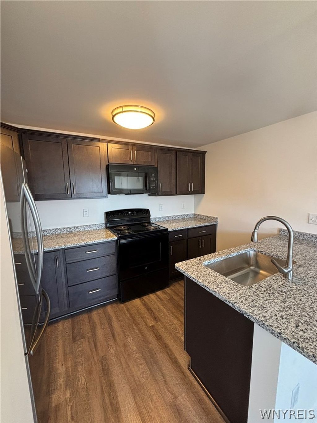 Photo of 1335 Millersport Highway #1335-06, Amherst, NY 14221 (MLS # B1677327)