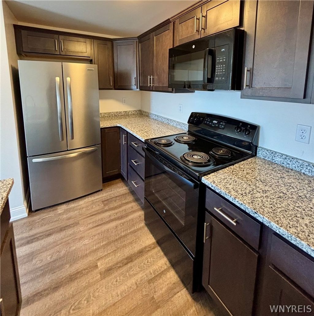 Photo of 1335 Millersport Highway #1335-06, Amherst, NY 14221 (MLS # B1677327)