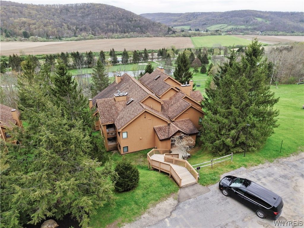 Photo of E104 Snowpine Village Vlg, Great Valley, NY 14741 (MLS # B1678282)