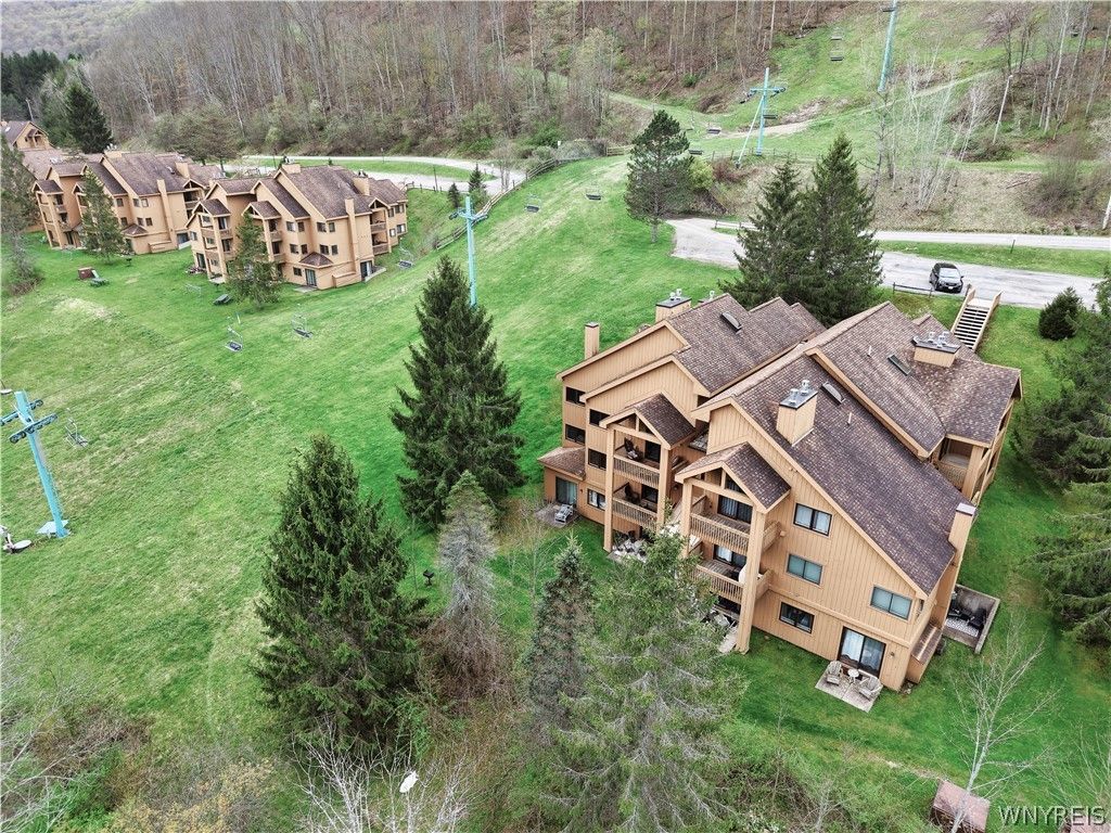 Photo of E104 Snowpine Village Vlg, Great Valley, NY 14741 (MLS # B1678282)