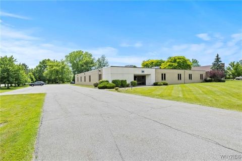 Photo of 331 John James Audubon Parkway, Amherst, NY 14228 (MLS # B1644024)