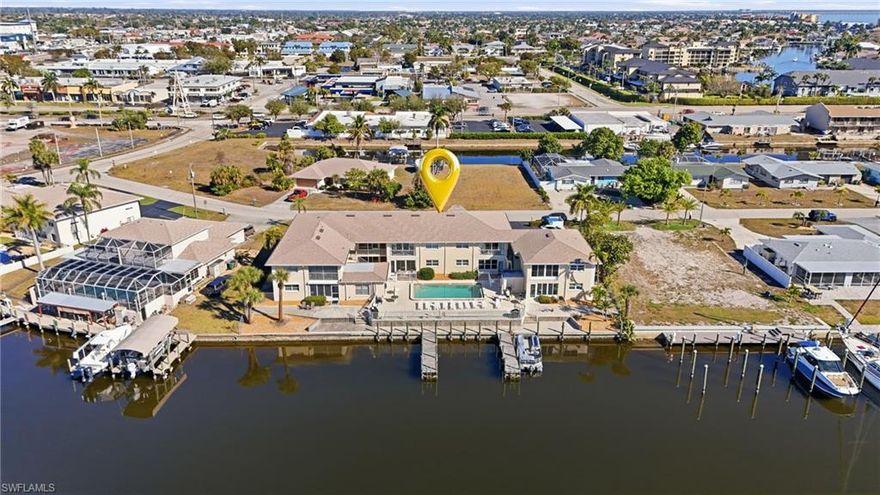 Welcome to 1714 Bikini Ct Apt 104 in Cape Coral, Florida, where boating lifestyle meets modern coastal elegance in one of Southwest Florida’s most desirable gulf access communities.

If you’ve been searching for a winter haven from harsh northern winters, this is your opportunity to own a move-in-ready waterfront condo with direct gulf access and boat slips, just minutes to open water.

This beautifully updated 2 bedroom, 2 bathroom condo blends high-end finishes with relaxed Florida living. The interior has been thoughtfully renovated with quartz countertops, Moen fixtures, a pot filler over the range, stainless appliances, and a striking modern backsplash that elevates the entire kitchen. The open-concept layout flows seamlessly into the living area, creating the perfect space for entertaining guests after a day on the water.

The lanai is where this home truly shines. Featuring impact windows with screens, you can enjoy magnificent calming canal views year-round, whether you are sipping coffee at sunrise or unwinding after sunset. The modern coastal color palette, luxury tile flooring, upgraded lighting, and spa-inspired bathrooms create a fresh, airy retreat designed for comfort and style.

This gulf access community offers boat slips, a sparkling community pool, clubhouse, and up to 3 parking spaces. HOA fees are $663 per month and include maintenance that keeps the property pristine, ideal for snowbirds or seasonal residents seeking low-maintenance living.

Located in the highly sought-after Cape Coral Yacht Club area, you are minutes from Cape Coral Beach, downtown Cape Coral entertainment district, waterfront restaurants, tiki bars, boutique shopping, farmers markets, and year-round community events. You’re also close to Tarpon Point Marina, Publix, local marinas, golf courses, and quick access to Fort Myers and Southwest Florida International Airport.

This is more than a condo. It is a boating lifestyle investment in one of Florida’s fastest-growing waterfront markets.

Whether you are looking for a seasonal escape, a full-time waterfront residence, or a smart investment property in Cape Coral with gulf access, this residence delivers comfort, location, and lifestyle.

Seller open to rate buy down concessions.