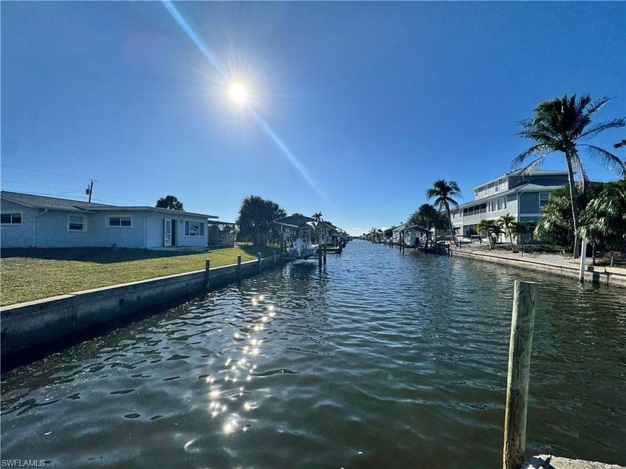 Pirate Harbor ! Beautifully remodeled 3-bedroom, 2-bath waterfront home situated on a desirable corner lot with stunning canal views. This move-in ready property offers direct water access and is perfect for boating enthusiasts, featuring a private boat dock with a covered lift for convenience and protection.

Inside, the home has been thoughtfully updated with a modern kitchen showcasing granite countertops, new custom cabinetry, and all new stainless steel appliances. The open and inviting layout creates a perfect space for entertaining or relaxing while enjoying the waterfront lifestyle.

With its prime location, stylish upgrades, and excellent boating access, this home is ideal as a full-time residence, seasonal retreat, or investment opportunity. Enjoy beautiful water views and the best of Florida living right from your backyard