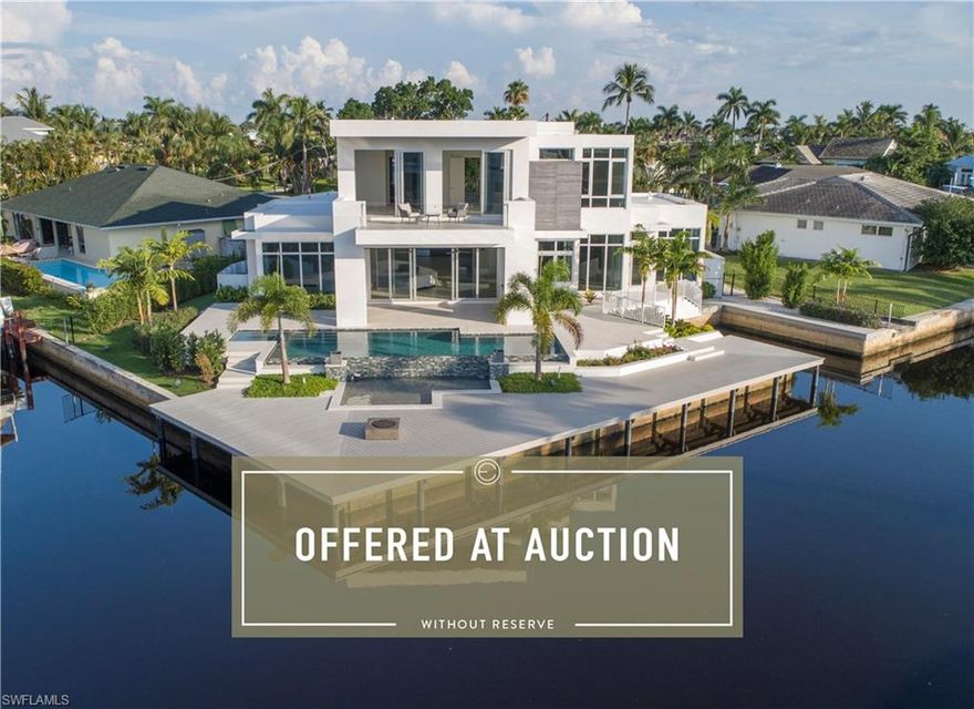 Located on a tip cul-de-sac location on one of Royal Harbor’s premier streets. Pegasus Builders, with the aid of Stofft Cooney Architects, has created a fresh look for Naples. Crisp, clean lines, abundant glass and soaring ceilings bring in Naples’ beautiful natural light. This new home features premium finishes, a gourmet kitchen, and first floor master bedroom. Enjoy basking in the sun on one of two decks on the first or second floors, from the large boat dock or while lounging in the saltwater infinity edge pool. The lot spans 170 feet of dock. The canal is deep and wide-water for big boat maneuvering. Just minutes by boat to Naples Bay with direct (no bridge) access to the Gulf of Mexico. A contemporary style blended with casual living is perfect for the Naples lifestyle.