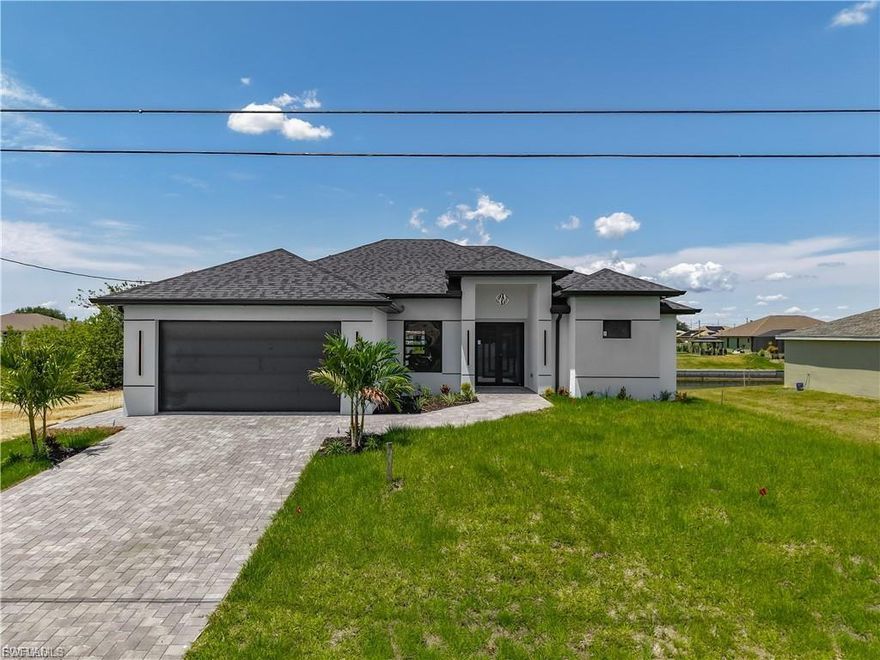 Brand new 2025 waterfront home for rent in Cape Coral!
Be the first to live in this stunning new construction featuring security cameras, built-in audio system, and washer & dryer included. Enjoy a modern open layout with 10-ft sliding glass doors, elegant tile flooring, and high-end finishes throughout.

The open-concept kitchen with stainless steel appliances flows perfectly into the living area—ideal for entertaining. The primary suite offers a luxurious bathroom with tub and separate shower, while all bedrooms include their own closets.

Relax on the spacious lanai overlooking a serene canal, or enjoy the epoxy-finished garage with exterior access door and functional laundry room with utility tub.

Modern, secure, waterfront, and 100% move-in ready—this is a rare opportunity to rent a brand-new luxury home in Cape Coral.