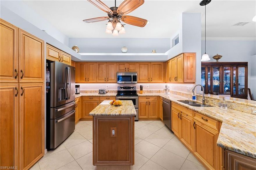 This is the largest villa floor plan available, the Portobello V, offering 2,006 square feet under air and private views of the lake, tranquil preserve, and fountain. The open and spacious layout includes three bedrooms or two bedrooms plus a den, and a two-car attached garage with built-in cabinetry & an included Tesla charger. The expansive screened lanai, finished with pavers, features a private in-ground Aqua Link 6’ x 6’ spa, creating an ideal setting for entertaining or unwinding while taking in the serene surroundings. The home is thoughtfully enhanced with granite kitchen countertops, 18x18 tile flooring throughout the main living areas, laminate flooring in guest bedroom, crown molding, custom window valances and shades, a newer refrigerator, and hardwood in the owner suite. New A/C (2024), paint throughout entire home(2024), new laminate flooring in guest bed(2023), and new water heat (2025). Every detail reflects comfort, functionality, and pride of ownership. Lighthouse Bay is designed for peace of mind and an active lifestyle. The community completed a roof replacement in 2020 with durable stone-coated steel shingles and it's set in a desirable X flood zone. Amenities include a lagoon-style pool, satellite pools, a lap pool, fitness center, sauna, tennis courts, bocce, two boathouses, and a vibrant clubhouse with a library and Arts & Learning Center. A full calendar of social and enrichment programs fosters a true sense of community. This home includes a Bronze membership to The Commons Club, providing access to the members-only Rookery Restaurant, community enrichment center, social programs, and the Village Green for special events. Optional upgrades are available for those who wish to add a private beach club membership and access to the 7,500-square-foot staffed fitness center and additional amenities. Ideally located in Estero, the property is just minutes from Coconut Point Mall with 140 retailers and restaurants, Lee Health Coconut Point, and a wide array of shopping and dining. Nearby attractions include South County Regional Library and Estero Community Park, Miromar Outlets, Hertz Arena, Florida Gulf Coast University, Gulf Coast Town Center, and Southwest Florida International Airport, all within a short drive. Downtown Fort Myers’ entertainment district is also easily accessible. This is a opportunity to own a spacious, lakefront villa in one of Estero’s most beautifully landscaped and amenity-rich communities