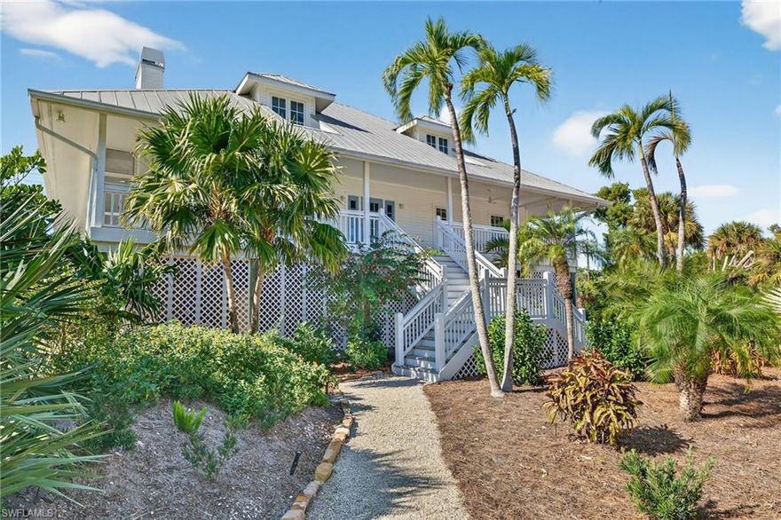 Perfectly combining Island Beach House with Southern Charm, this incredible home sits along a quiet shell road that leads to the Gulf: amazing proximity to the beach with no roads to cross! With a double lot, expansive pool area, welcoming front and back porches, high ceilings, large rooms, and custom features, this is an incredible opportunity. The gracious front steps lead to a spacious covered porch that is just perfect for enjoying this spectacular location. The huge primary bedroom is on the main living level along with an additional bedroom, a den, a large eat-in kitchen, and a fabulous living and dining room. Upstairs, two additional bedrooms, a sitting room, and a fabulous sun porch provide plenty of room for family or guests. A vertical platform lift at the back porch makes access to the home easy and makes carrying luggage and groceries a breeze! Huge amounts of storage are available in the eaves and under the house. A fenced area in addition to the pool area is perfect for a dog run. This wonderful property is much more than a beach house.... it is ready to be your island home!
