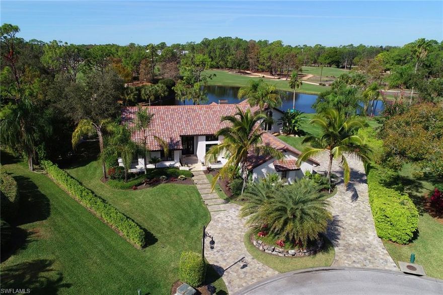 Timeless and Modern with Coastal Charm!  Awash in natural light, this home overlooks and nestles around a lake showcasing the amazing view.  Masterfully designed for entertaining, this magnificent layout offers a special distinction between the inside and out offering a flow that truly defines the ultimate Naples lifestyle.  a stunning outdoor fireplace and grilling station with the glistening pool and a large grassy lawn that spills into the lake but allows plenty of room for an afternoon badminton match or old fashioned picnic.  A highlight is the phenomenal kitchen with quality that you are certain to enjoy.  A secondary master suite with a bonus room, adjoining office and sauna creates an illusion of privacy without feeling disconnected.  This is your opportunity to enjoy a home that embodies a TRUE refined coastal living experience!