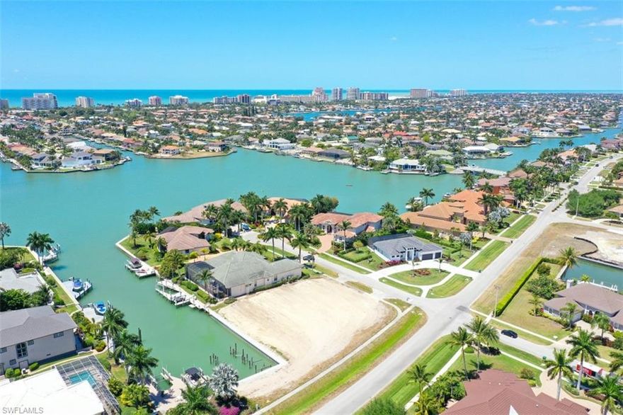 L5533 This is a large, 1/2 acre lot with Southern Exposure and quick direct boating access to the Gulf of Mexico. Brand new seawall in February, 2022. Lot was recently cleared and is builder-ready for your dream home. Great opportunity to own one of the few lots left in the highly sought after, prestigious Estate Section.