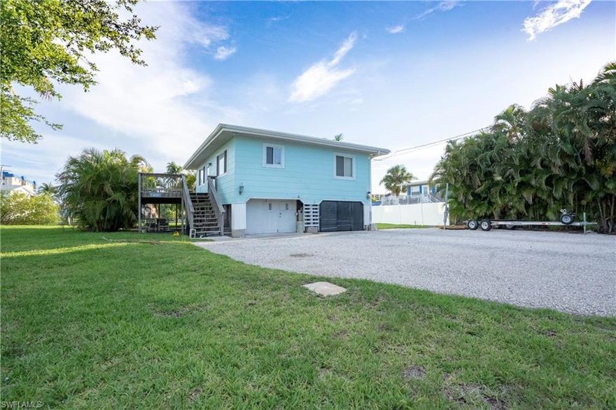 Looking for a WATERFRONT beach property with easy on & off access, walking distance to all the Fort Myers Beach hot spots and plenty of parking for your cars AND all your water toys? Check out this fantastic gulf access home located on the North End of Fort Myers Beach. Old Florida Style living in this elevated home. This charming cottage sits on a HUGE lot that is OVER 15,000 square feet. Second floor living space features a spacious deck, open concept living area, 2 bedrooms and 1 bath. The lower level has convenient A/C storage and laundry room and one car port.