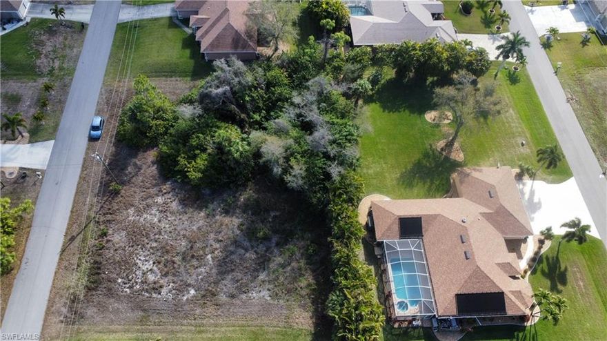 Highly desirable vacant lot in a very popular area of Cape Coral, NO HOA, NO CDD, many new development is going up in the area, quiet neighborhood, easy access to open water and short distance to Punta Gorda. Taxes are low, buy now before price goes higher and build later.