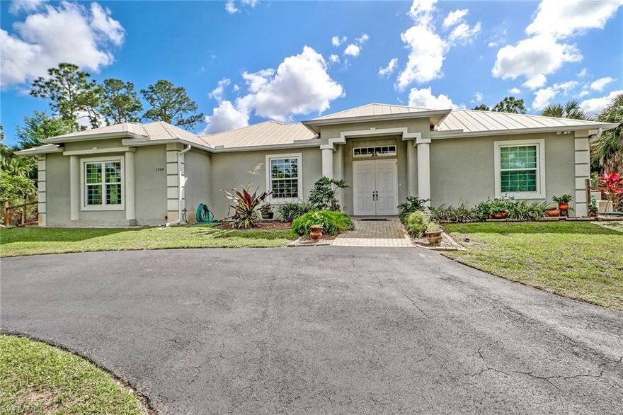 This Unique custom built Home features 3 bedrooms, 2 bathrooms, Den and attached 1 bedroom and bath on 2.5 acres in Golden Gate Estates. When you walk into the front door you're welcomed with beautiful pool views! Open floor plan is perfect for entertaining and enjoying the scenic views to your private sanctuary. Metal Roof, 700 sq. ft. back porch, huge den and walk in closets in the Master. The retreat is deep-set into to the lot for added privacy off the main road. If you are looking for peace and tranquility- this is it! Plenty of room for your future Shop, Garden, Horses, or anything your heart desires!