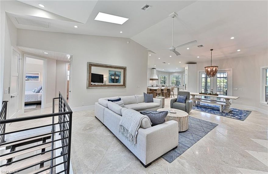 This Southport on the Bay 6 bedroom 4 bath coastal designed home was completely reimagined! Southport on the Bay is a double gated community within Barefoot Beach.  With lake front views the property also offers a rare horizontal open plan with grand 20' ceilings heights. This home features modern light coastal interior fixtures and finishes, new metal roof, impact glass windows & doors, all new pool & spa, new pool cage, new landscaping, fenced yard, private and private elevator. Expansive outdoor living with covered plantation style porch. The swimming pool enclave includes indoor and covered outdoor entertaining area that includes dual seating areas with HDTV, fireplace, pass thru bar, rope swing seats, marble paver deck, and summer kitchen. This home is a short stroll to the private beach access and boat slips are available for lease.  Home is located on a lake with fountain and overlooks the private Barefoot Beach preserve. The master suite offers it’s own lanai access and an all new bath with wet space that includes shower with tub. This home is sold turnkey furnished, needs nothing and is ready for you to enjoy, plus offers new elevated pool equipment, full storm panels and a 3 car garage. Barefoot Beach, Collier County’s premier gated beach to bay community, amenities include 24 hour guards and patrols. Option to join the Club at Barefoot Beach (located in the community) which offers casual & fine dining restaurants, pool & beachside food, drinks, chair service, indoor & outdoor bars, ice cream & coffee shop, tennis courts with pro & a full events calendar. (waitlist with usage during wait period). Minutes to Mercato, Coconut Point Mall, Promenade & Waterside, the airports and golfing. Boat docks are available for lease or purchase right across the street.