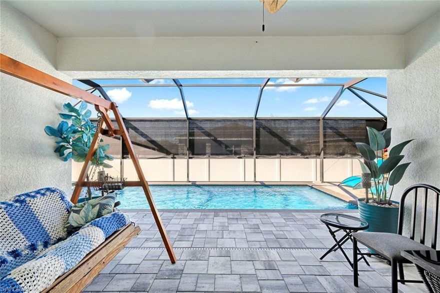 2023 Pool home located in a peaceful NE Cape Coral neighborhood, this well-cared-for 4-bedroom, 2-bath pool home offers quality upgrades, reliability, and true move-in readiness. Positioned in a no-flood zone, the property features Category 5 hurricane-rated impact windows, a fully fenced backyard, and several improvements designed to provide comfort and long-term peace of mind.

The outdoor area is perfect for enjoying Florida living year-round, highlighted by a professionally maintained swimming pool with a heater and a screened pool cage that provides comfort while keeping maintenance simple. The home has been consistently maintained, including routine termite prevention, a water softening system, water heater servicing, and a septic system that is professionally serviced every quarter.

Additional upgrades include whole-house rain gutters with pop-up drains, an enhanced sprinkler system, an epoxy-finished garage floor, an EV charging station, and a generator-ready setup with an exterior pigtail connection and utility standby plate.

All appliances are included, making this property truly move-in ready.

Conveniently located near schools, shopping, dining, and major roadways, this home offers a great combination of comfort, practicality, and thoughtful upgrades in one of NE Cape Coral’s established residential neighborhoods.
