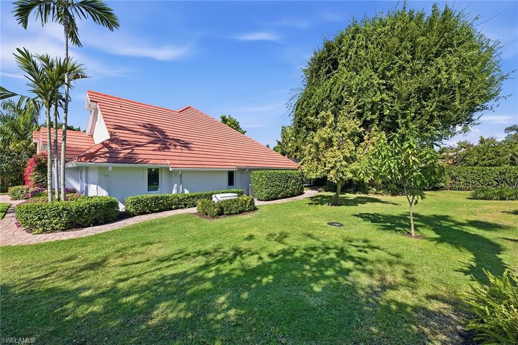 Photo of 721 Turkey Oak LN, NAPLES, FL 34108 (MLS # 226005667)