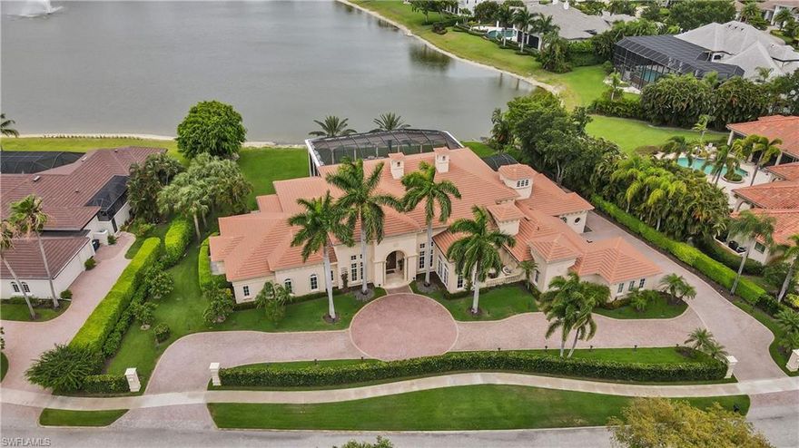 This Mediterranean style grande estate home has a sensational 11-acre lake view! Master suite provides a private room for massage table, exercise equipment, or etc. Master bathroom has his and hers vanities with his and hers walk-in closets. 18' foot ceilings and an open floor plan with an elegant living room and family room separated by floor to ceiling fireplace and wet bar. Formal dining room and large morning room are separated by the butlers pantry.  4-car garage with a very long circle driveway for extra parking. Expansive outdoor screened-in lanai with outdoor kitchen and fireplace.  Quail West Country Club provides top-of-line amenities including 8 har-tru lighted tennis courts, 2 championship golf courses, 2-story fitness center, indoor and outdoor dining, full service salon, indoor pool and spa and so much more.