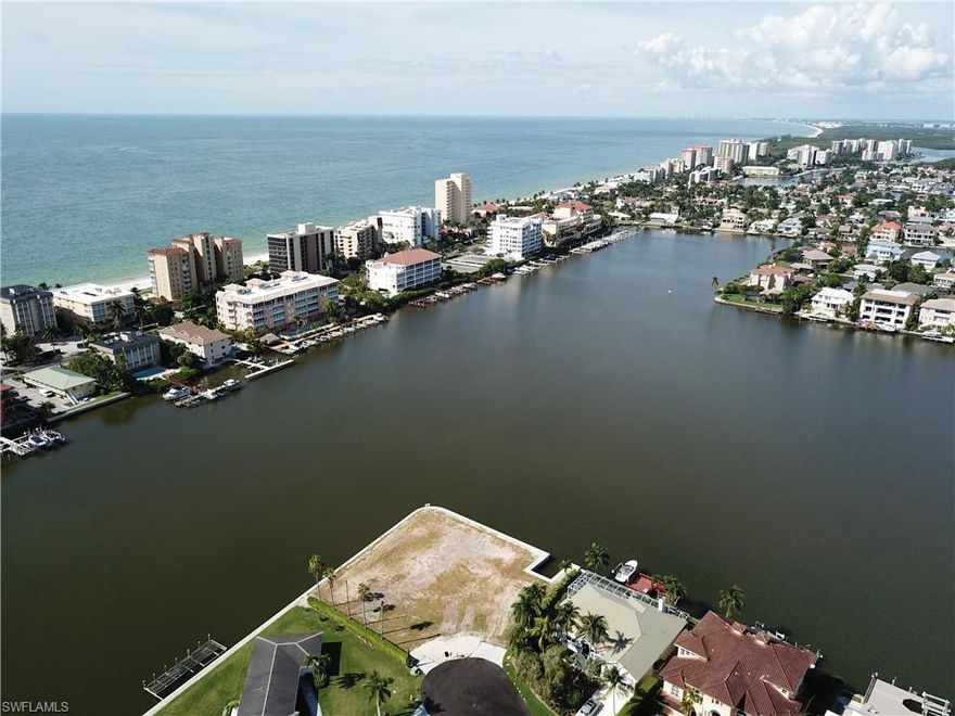 Take advantage of an extremely rare opportunity to own and build on this half acre lot that hasn't been available in over 40 years! This unique point lot is one of the largest lots in all of the Conners with over 300 feet of water frontage, offering expansive western and northern water views of Vanderbilt Lagoon. This perfect lot is cleared and ready to be built on. The current owner just completed construction of 380 feet of seawall with the ability to add a grandfathered boat house to future dock. This lot is located less than 1 mile to the Ritz Carlton and Vanderbilt Beach.