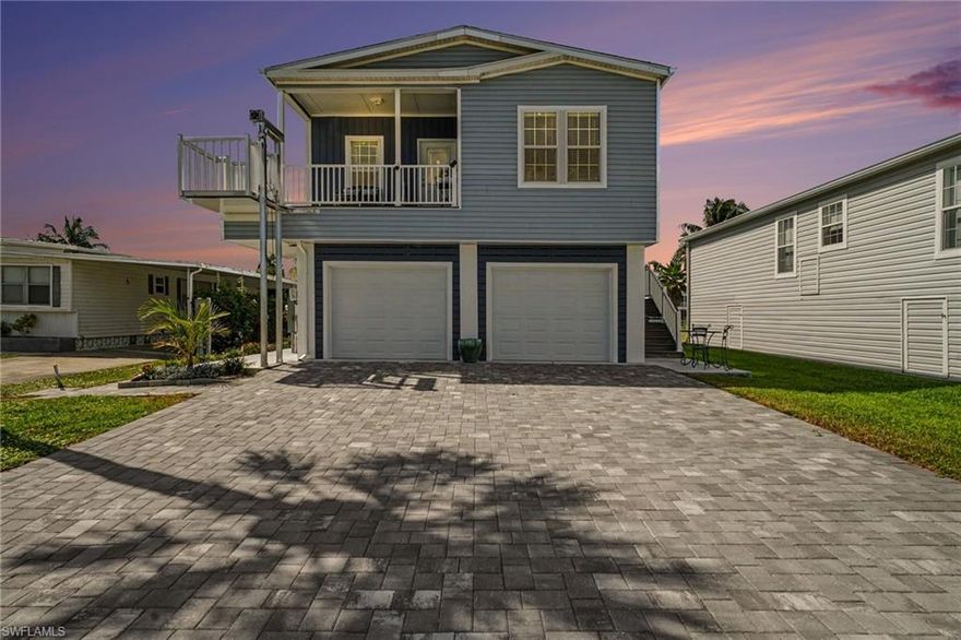 Welcome to your coastal retreat in the highly sought-after 55+ community of Bayside Estates in Fort Myers Beach.

This beautifully elevated home offers the perfect combination of comfort, functionality, and the laid-back Southwest Florida lifestyle—just under 3 miles from the beach. Whether you prefer a quick bike ride to the shore or enjoying the vibrant community amenities, this location truly delivers.

Step inside to discover a bright, open-concept living space featuring 9-foot ceilings, tray ceilings, crown molding, and luxury vinyl plank flooring throughout. The kitchen is designed for both everyday living and entertaining, complete with stainless steel appliances, a spacious island, and ample cabinetry.

Recent upgrades set this home apart. The lower level has been  enclosed with a beach vibe and  freshly painted, creating a large garage area with two remote-operated doors.   A Culligan water treatment system has also been added for enhanced water quality and peace of mind.

Additional highlights include:
Private lift for easy access
Covered porch/deck perfect for relaxing mornings or evenings
Generous parking with space for multiple vehicles
Being offered turnkey furnished—just bring your suitcase

Bayside Estates is a resident-owned community known for its active lifestyle and welcoming atmosphere. Enjoy all of the amenities and a full calendar of events including live entertainment, pool gatherings, bingo nights, and social clubs.

This is a rare opportunity to own a move-in-ready  elevated 2024 home in one of the area’s most desirable boating and lifestyle communities.