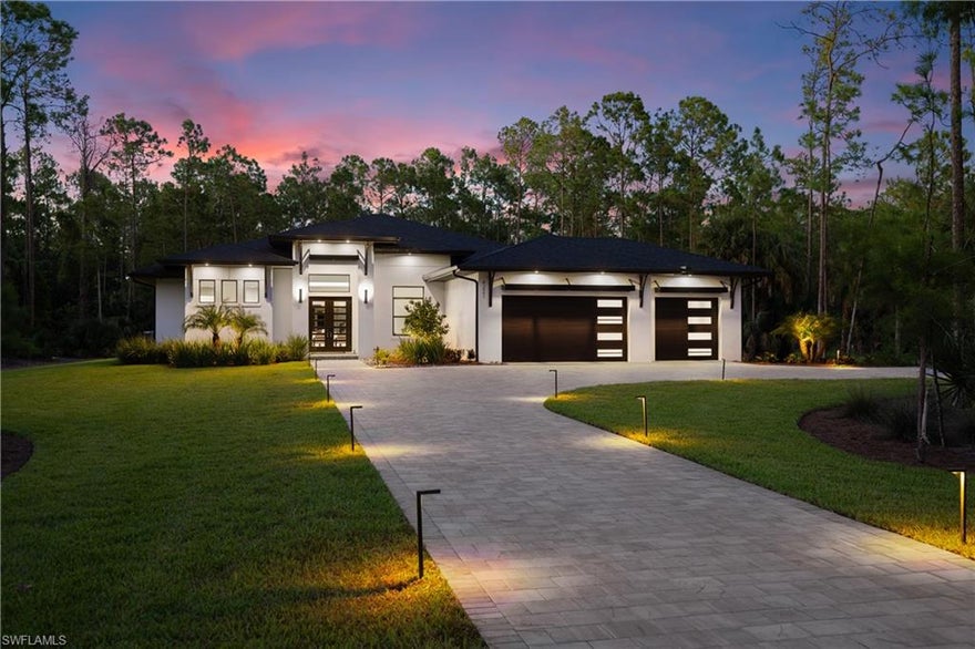 Nearly three acres of 100% uplands. No HOA. Brand-new construction west of Collier Boulevard. In Naples, very few properties check all three boxes. Built by Forge Construction, this four-bedroom plus den home was designed for buyers who care as much about construction quality and infrastructure as they do finishes. The home features Thermador appliances, induction cooking, custom Naples-built cabinetry, marble and quartz surfaces, designer lighting, and a functional open layout that lives well day to day. The kitchen, living, and outdoor spaces connect seamlessly to a screened lanai with a saltwater pool and spa, outdoor kitchen, and preserve views with exceptional privacy. The primary suite opens directly to the pool area and includes oversized walk-in closets, dual vanities, soaking tub, and large walk-through shower. What separates this property from most new construction is what you don’t immediately see: PGT impact windows and doors, 400-amp electrical service, whole-house reverse osmosis, instant hot water recirculation, zoned HVAC with dehumidifiers, Sonos integration, security pre-wire, insulated garage doors, and epoxy garage floors. The land is the difference maker. Zoned for horses with nearly three usable acres, there is room for a guest house, barn, additional garage, pickleball court, or future expansion without the limitations that come with most Naples communities. Minutes from beaches, shopping, dining, and top-rated schools, this is a rare combination of new construction, acreage, privacy, and freedom.