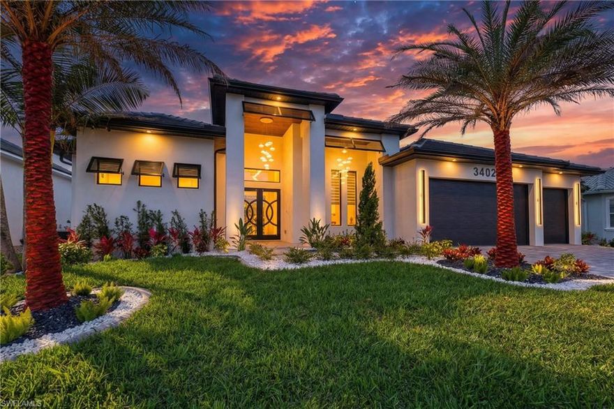 Newly built luxury residence with direct access to the Gulf, located in the Cape Coral area, one of the most desirable neighborhoods to live. Just a few minutes from Shopping Centers, Publix, restaurants and essential services, offering an ideal combination of location, comfort and lifestyle. The property presents an open concept design, integrating living room, dining room and kitchen to create wide, modern spaces full of natural light. Garage for 3 cars with a reflector epoxy. The kitchen has modern appliances and high-end contemporary finishes, high quality cabinet and taj Mahal quartzite. It has impact doors and windows against hurricanes, security camera system, speaker system inside and outside the property, curtains throughout the house. The residence has 4 bedrooms, 3 and a half bathrooms, in addition to an office, all carefully designed and complemented with luxury lamps that bring elegance and sophistication in each environment. The outdoor area is designed for entertainment and enjoyment, with a beautiful pool with spa and waterfall, salt system, equipped with heater and intelligent system that allows you to control the temperature from the phone, providing security, comfort and advanced technology, outdoor kitchen with screen. This property also has an exquisitely designed garden with high and sophisticated palm trees, creating a tropical and exclusive atmosphere. An exceptional opportunity to acquire a completely new property in one of the best areas of Cape Coral.