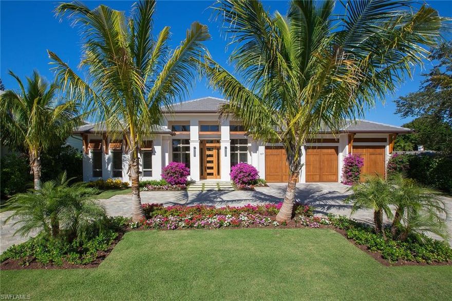 New construction, custom-built Knauf-Koenig home defines luxury living. This residence exudes elegance with European white oak flooring throughout. From the gracious foyer, step into the open concept great room which flows to the well-appointed, chef's kitchen with quartzite countertops. A built-in beverage station is conveniently located off the dining area. The large outdoor living area is ideal for entertaining with mosaic tiled pool, infinity spa, full outdoor kitchen and fireplace and includes both covered, as well as open sitting areas to enjoy the Naples sunshine. The master bedroom is a private retreat to relax away the day, enjoying calming views of the outdoor oasis. The spa-like master bath includes a soaking tub, generous shower with glass mosaic tile and spacious walk-in closet. Residents of the Moorings are eligible for membership in the private Moorings Beach Park.