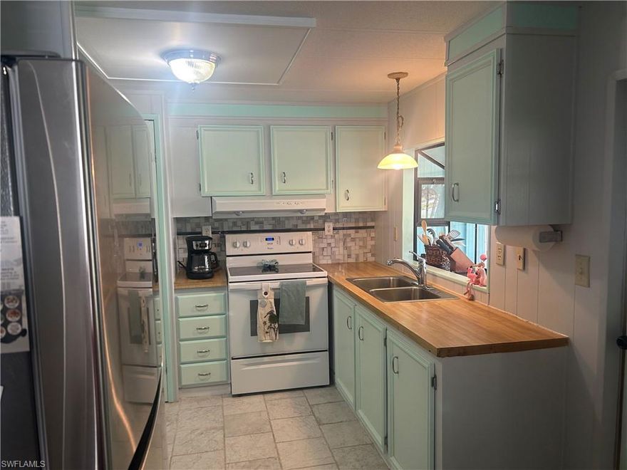 Welcome to this beautifully maintained manufactured home located in the desirable West Wind Estates, a sought-after 55+ community in Naples, Florida. Offering 1,104 square feet of living space, this home features two bedrooms and two bathrooms with an exceptionally spacious and well-designed interior layout. This residence offers three distinct living areas, including a generously sized living room, a separate dining area, and an additional family or great room—providing flexibility for entertaining, relaxing, or hosting guests. The bedrooms are nicely sized, and the overall interior feels open and inviting, with an emphasis on gathering and living space—perfect for both full-time residents and seasonal homeowners. West Wind Estates is known for its active lifestyle, offering a variety of community activities and amenities designed for residents 55 and over. Ideally located, the community is just minutes from downtown Naples, world-class shopping, dining, boating, and the area’s beautiful Gulf beaches. While close to everything Naples has to offer, the neighborhood is tucked away, providing a peaceful retreat from the city lights and bustle.

Additionally, the seller is offering an extra vacant lot within the community, located off Pine Key, providing a unique opportunity for a buyer who may wish to purchase both the home and the additional lot. The vacant lot may be used for placement of another manufactured home, subject to community approval and guidelines.