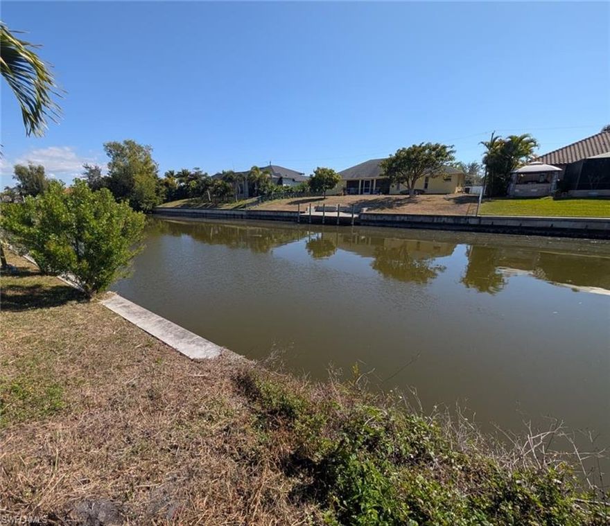 Discover the perfect location to build your dream home on this southern exposure gulf-access waterfront lot in beautiful SW Cape Coral. Situated in the highly desirable SW area of Cape Coral, this property offers stunning water views and sun throughout the day due to its southern exposure. The lot features a new seawall, saving you significant construction costs and giving you a head start on building. The lot itself is also relatively high, so not a lot of fill will be needed for construction, saving you money. This property offers easy access to shopping, dining, tons of schools within a mile, and all the amenities Southwest Florida has to offer. Whether you're planning to build now or invest for the future, this waterfront homesite is a fantastic opportunity. The assessments are nearly paid off! Don't miss your chance to own a piece of boating paradise with an amazing gulf-access canal view, southern exposure, and a new seawall already in place on this gulf access property! *The lots next door is available for sale too - Buy both and build the home of your dreams on half an acre*