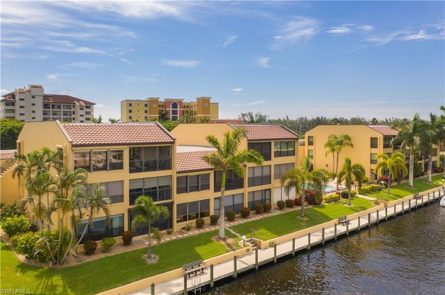 If you want a Great condo on the water in great location this could be it.  Don't delay.  This is a 55+ property. One person must be 55+ The property is a corner unit on the second floor overlooking a wide canal from the rear.   Being a corner unit this condo offers two extra side windows overlooking the pool.  The living room offers a huge window overlooking the canal . This Condo needs updating but is priced to Sell in this incredible location.  New boat slips are being installed soon and the buyer can lease one at this point.  There are a couple of slips available for lease at the moment.   The information on them is attached.  The garage is very deep which offers a lot of storage area.  Complex is across the street from Jaycee Park which offers so many amenities and events.  Condo was repiped in 2012 with a second shut off in the unit.  AC was replaced in 2010.   Extremely well kept complex and in one of the best locations of Cape Coral.  Will Not Last!