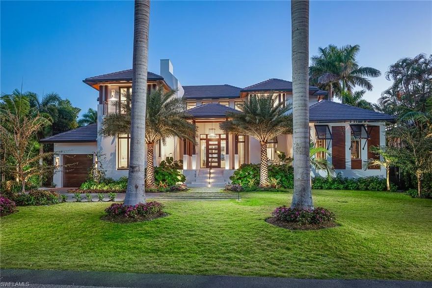 Ideally positioned only two homes from the beach, this coastal-contemporary design brings a fresh look to Old Naples living. Large rooms with an open floor plan for Florida living at its best. This home features fabulous covered/uncovered outdoor living with pool areas bathed in warm southern sunshine, allowing for a year-round appreciation. Intricate tongue-and-groove ceiling detail along with richly paneled walls highlighted by exquisite lighting. The remarkable library can only be described as "class personified" and offers a wet bar and wine fridge. The magnificent kitchen offers beautiful dual-tone cabinetry with classic brass-toned hardware, a paneled Miele dishwasher, a Miele coffee system, Wolf Teppanyaki griddle, induction, gas cooktop and so much more. Guests can enjoy a glimpse of the Gulf from the upper guest level lounge. This home has an understated eloquence and truly must be seen to be believed.