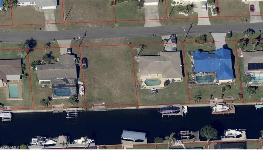 You must see this great lot for building your next home. Located on the Genoa Canal, by boat the lot is only 15 minutes and one bridge to the Caloosahatchee River. Enjoy Southwest Florida winters fishing, waterskiing and waterfront restaurant hopping while your family and friends are freezing! It has a seawall already and water and sewer assessments are PAID! This location is very close to shopping, restaurants, schools, and only a few minutes to Ft. Myers.