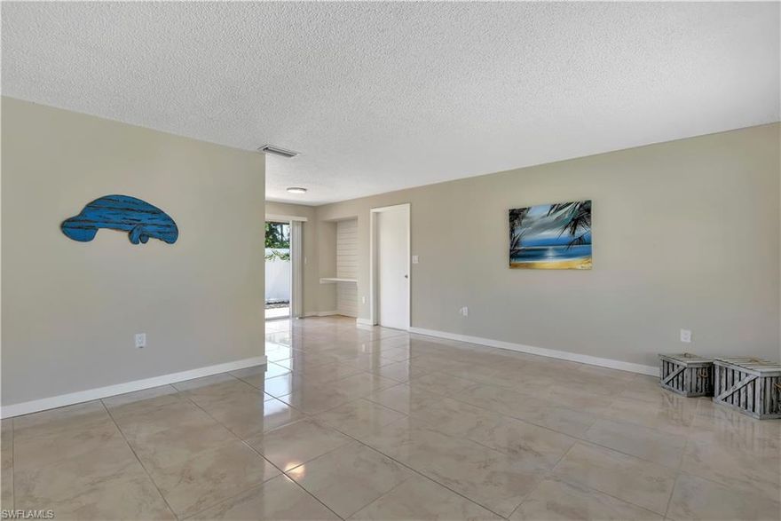 Renovated single family home in Naples Park! Fantastic location... West of US 41 & close to the Gulf of Mexico! Situated on oversized corner lot in Naples Park, a non-gated up & coming community that offers not just close proximity to the beach, but also less than 10 miles from the world-famous 5th Ave district. This updated 3 bedroom features a freshly painted interior, 2 yr old roof (placed on home in 2018), shiplap wall in great room & dining area, kitchen with stainless steel appliances & quartz countertops, renovated bathroom, privacy fence in rear of home, new tropical landscaping, and tile flooring throughout. The backyard offers wonderful outdoor living space with an open lanai, plus the backyard can easily be fully fenced by adding just one wall of fencing & a gate. There is plenty of parking with a wide & long drive in addition to a rock parking area adjacent to the driveway. Naples Park is top of the list in UP & COMING Naples' neighborhoods. It offers a convenient location, just around the corner from US 41, surrounded by lots of dining & shopping options, plus right around the corner from the sandy beaches of SWFL. Ready for a new owner & absolutely 100% move-in ready!