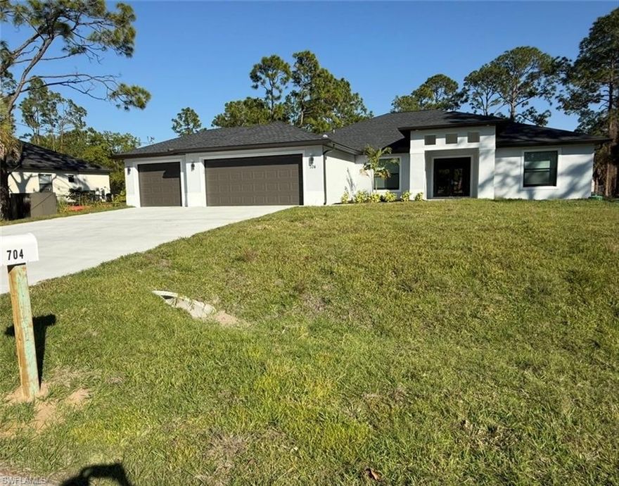 This 4 bedroom, 3bath, 3 car garage, 1 acre lot, new construction home in Lehigh Acres, FL, sable palm model plus floor plan offers plenty of space for the whole family. The separate dinning and living room can also be used as flex spaces. Hurricane rated windows and doors and extra large garage on this large lot, living room has Custom made TV wall decoration, granite counter top with wood grade kitchen cabinets. This home comes with 1 year full warranty and 10 year structural warranty.