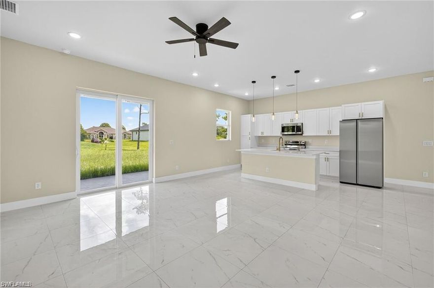Enjoy the Florida lifestyle in this beautifully detailed, move-in ready new construction home! This property offers 3 bedrooms plus a den, 2 bathrooms, an open floor plan, and a double-car garage. Interior highlights include 24x24 tile flooring throughout, stainless steel appliances, quartz countertops, LED light fixtures, 10 ft ceilings, soft shaker cabinetry, and impact windows for enhanced safety and style. The laundry room is equipped with a Samsung washer and dryer . Built for comfort and durability, the home also includes a full sprinkler system to keep your lawn lush year-round. The open layout features a spacious living area, a deluxe kitchen, and a dining room, making it ideal for entertaining. The primary suite includes a large walk-in closet, dual vanities, and a walk-in shower. Located near SWFL International Airport, FGCU, shopping centers, and dining, this home offers easy access to all the best of Southwest Florida.