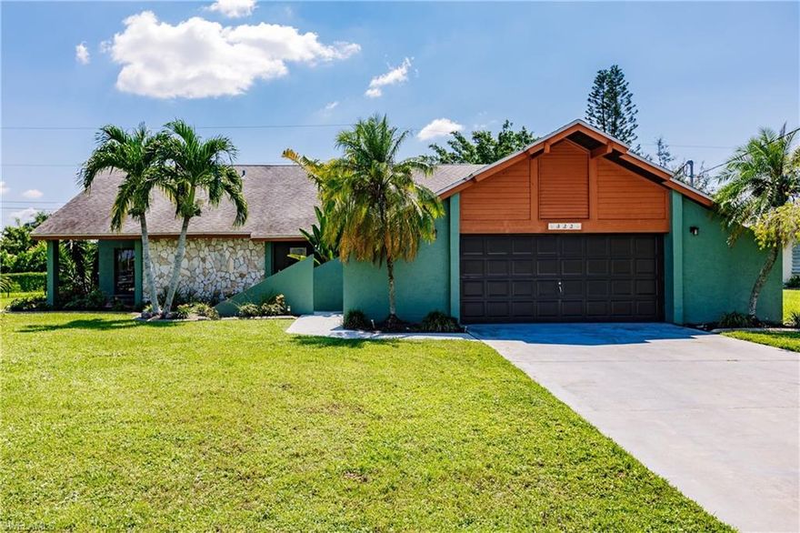 Tropical and move-in ready pool home. Several sliding glass doors gives access to the screened lanai from almost every room in the home, including two of the three bedrooms. Third bedroom sliding glass door will lead you to a separate, side yard sitting area.  Split floor plan, updated kitchen with stainless steel appliances, breakfast bar and granite countertops.  Interior of the home features tile flooring throughout, vaulted ceilings and skylights providing an abundance of natural light. Large master bedroom boasts a walk-in closet and bath with dual glass bowl sinks, separate shower and a tub/shower combo as well. This home is positioned at the end of a quiet street yet minutes to town. Plenty of room for outdoor entertaining, southern rear facing with a solar, heated pool to enjoy all year long. All utility assessments are paid in full. Property is not located in a flood zone.  Flood insurance is not mandatory. Just a few minutes to shopping and dining and only 30 minutes to RSW Ft. Myers Airport. Entire pool cage was rescreened in November 2022.  Washer and dryer convey.  Furnishings are negotiable-please inquire.
