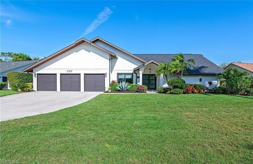 Stunning Kings Lake rental available now in one of Naples' most desirable communities. This completely remodeled 3-bedroom, 2-bath home offers 3,000 sq ft under air and over 5,500 sq ft total, and is being offered turnkey furnished for an annual or long-term tenancy of 6 months or more. From the moment you walk in, the soaring cathedral ceiling and gleaming neutral porcelain floors set the tone for the quality throughout. The open concept kitchen is the heart of the home, showcasing high-end stainless steel appliances, a gas cooktop, white wood soft-close cabinetry, a breakfast nook, wine and coffee bar, and breathtaking Taj Mahal quartzite countertops. French doors lead to a fully air-conditioned Florida room overlooking the heated pool, creating the perfect indoor-outdoor flow for entertaining. A separate dining area sits just off the kitchen beside a second living space with double French doors and sweeping pool and garden views surrounded by lush privacy hedging. The main suite is exceptional, featuring a large walk-in closet with custom built-in shelving, double sinks, soaking tub, and an oversized walk-in shower. Both guest bedrooms are well sized with rich wood laminate flooring, and one includes a walk-in closet with custom shelving. The large laundry room includes cabinetry, quartz countertops, a utility sink, plus washer and dryer. Impact windows and doors provide peace of mind throughout. The expansive pool deck and covered lanai make outdoor living a daily pleasure. The rare 3-car garage with beautiful epoxy floors adds storage and flexibility, perfect for vehicles, a golf cart, or guest use. Kings Lake is a highly desirable, established community built around a scenic 30-acre lake with walking and biking trails, tennis and pickleball courts, and the Kings Lake Square shopping center just steps away featuring Publix, Starbucks, and multiple dining options. Just 3 miles to the world-class restaurants, boutique shops, and galleries of famous 5th Avenue South and only 3.5 miles to the white sand beaches and the Naples Pier on the Gulf of America.