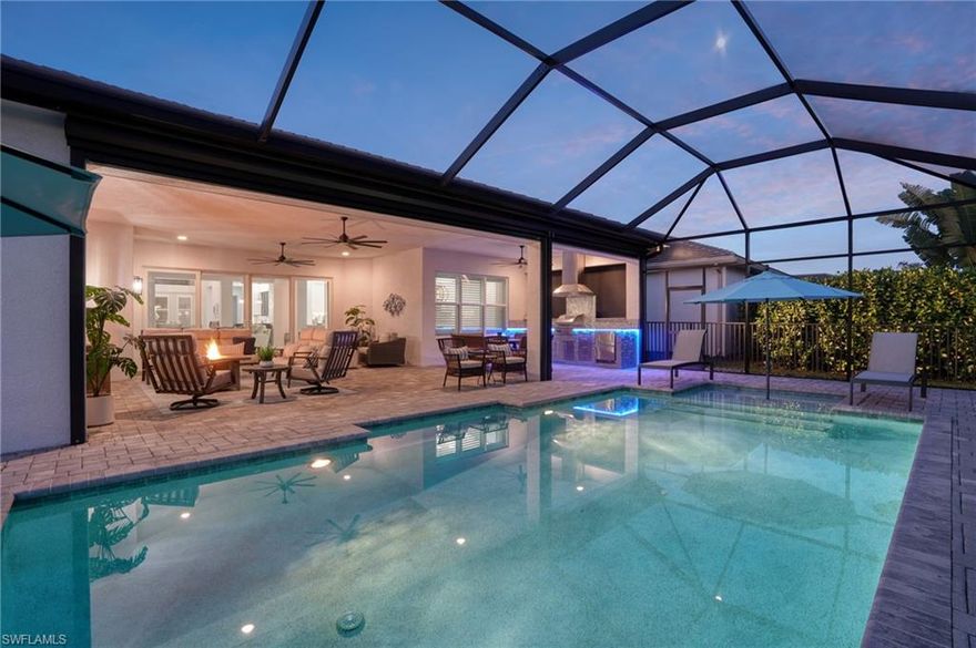 Don’t miss a rare opportunity to own this move in ready home with a pristine preserve view; southern exposure enjoyed from the large covered lanai, resort style pool in a prestigious gated resort community in Naples. This newly constructed Estero floorplan by GL Homes occupies a prime lot backing directly to a private preserve
owned by Valencia Trails—meaning it can never be developed. This ensures lasting quiet and unobstructed natural views, while the property remains just a short walk to the impressive clubhouse and resort-style amenities.
Spanning 3,154 square feet under air, the residence offers 3 bedrooms, 3 full baths, and a convenient half bath (cabana/guest powder room). The versatile club room, with its own separate entrance, provides flexibility as a private office, guest suite, game room, art studio, or whatever suits your lifestyle. The handsome front elevation features a gated entrance courtyard with a serene water feature, creating an elegant first impression. Beautifully designed stone front exterior presents two front-facing garage entrance for easy coming and going, and a side-entry, single-car garage for three-car covered parking overall. 
Thoughtfully designed for sophisticated entertaining, the open layout flows effortlessly from the gourmet kitchen to dining and living areas, enhanced by a dedicated bar space off the kitchen. The expansive covered lanai—measuring 37 x 24 feet—includes Storm Smart hurricane roll-down shutters for all-season enjoyment. It features a custom summer kitchen with Tec grill, LED lighting, sink, refrigerator, and additional refinements. The large pool, complete with auto-fill and full screen enclosure, overlooks the protected preserve. A fenced backyard offers a secure, private area for pets. Meticulously maintained from new, this home blends refined design, high-quality
finishes, and the exceptional Valencia Trails lifestyle—delivering convenient North Naples access to fine dining, shopping, beaches, and more, all within a gated, amenity-rich 55+ community.