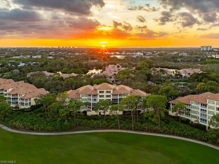 Within the prestigious enclave of Wedgewood at Bonita Bay, residence number four zero three at Two Six Nine One Zero Wedgewood Drive offers a refined interpretation of resort-style condominium living, framed by sweeping lake and golf course views. This beautifully remodeled three-bedroom, two-bath residence is thoughtfully designed to capture light, scenery, and an effortless indoor-outdoor lifestyle. Luxury Vinyl and polished marble flooring flow throughout the sunlit living spaces, creating a sophisticated yet inviting atmosphere. The updated kitchen is both elegant and functional, featuring granite countertops, an under-mount sink, refined cabinetry, and stainless-steel appliances, all positioned to enjoy tranquil water and fairway vistas. Adjacent dining and living areas open seamlessly to the lanai, which has been thoughtfully converted into extended interior living space with sliding glass doors along the screened enclosure, ideal for entertaining or quiet relaxation. The primary suite is a serene retreat, highlighted by a grand picture window that perfectly frames lush greens and reflective ponds. Two additional guest bedrooms provide comfort and flexibility for visitors or a home office. Modern conveniences include a well-maintained air-conditioning system installed in two thousand sixteen and a water heater replaced in two thousand twenty-one, ensuring peace of mind. A rare private two-car enclosed garage adds exceptional value and convenience. Residents of Wedgewood enjoy a resort-style pool, tennis courts, screened pavilion, and gas grilling area set within a park-like landscape. Beyond, Bonita Bay offers waterfront parks, a private beach, marina access to the Gulf, and optional membership to the Bonita Bay Club with championship golf, dining, fitness, and spa amenities. Ideally located near dining, shopping, and regional travel access, this residence presents a compelling opportunity to embrace the elevated Bonita Bay lifestyle.