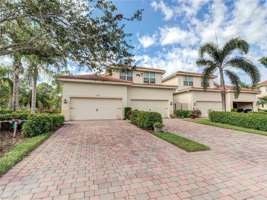 This beautifully maintained first-floor coach home delivers the perfect blend of space, style, and low-maintenance living. Offering 3 bedrooms, 2 baths, and 1,752 square feet, it welcomes you with a charming paver driveway and an attached 2-car garage. Inside, abundant natural light floods the open floor plan through impact-resistant windows and doors, creating a bright and inviting atmosphere. The kitchen shines with granite countertops, stainless steel appliances, and generous cabinetry—ideal for both everyday cooking and entertaining—while the dining area and cozy breakfast nook provide versatile options for gatherings. The spacious primary suite is a true retreat, enhanced with crown molding, a walk-in closet, and a luxurious ensuite featuring dual vanities, a soaking tub, and a walk-in shower. Step out to the screened lanai to relax with peaceful preserve views and complete privacy. Located in the gated community of Emerson Square, residents enjoy access to plenty of amenities including a pool, clubhouse, and fitness room. Convenience is unmatched with quick access to US-41 and Alico Road, placing you near top shopping, dining, and entertainment—plus all the best of Southwest Florida living. This is the lifestyle you’ve been waiting for!