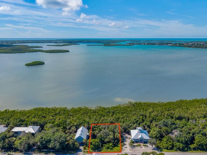 Discover your slice of tropical paradise on this exceptional vacant lot on Marco Island, offering a great opportunity to build your dream home in one of Florida’s most sought-after coastal communities. This beautiful building site boasts southern exposure, providing all-day sun on your future pool and lanai—perfect for soaking up the warm Florida rays or entertaining guests in a sun-drenched setting. This parcel backs up to the pristine waters of Barfield Bay and an unspoiled mangrove coastline where you'll enjoy the soothing sights and sounds of nature. With dimensions of 100' x 130', this extra-large parcel offers ample space for a luxurious custom home, tropical landscaping, and all the features you envision in your personal retreat. Whether you're planning a full-time residence or a winter escape, this lot provides the perfect canvas for Southwest Florida living!