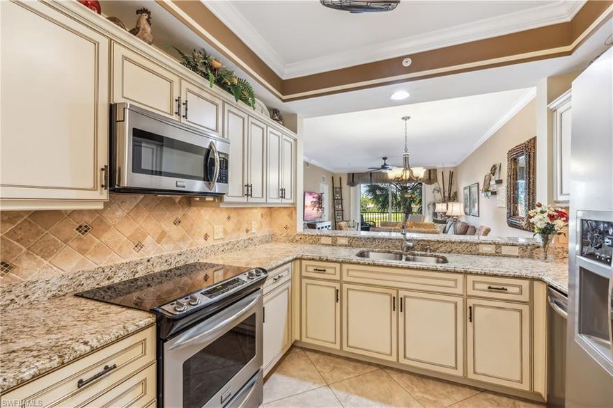 Beautiful TURNKEY Golf membership home. Upgraded kitchen w/ premium Kraft Made cabinetry w/ lighting & soft close doors & drawers, granite counters & stainless steel appliances. Nicely painted in soft tones & accented w/ custom lights, phantom screen door, plantation shutters & crown molding. You're sure to have peace of mind w/ an updated ac & water heater in 2019 along w/ high impact windows & doors that offers extra protection & are energy efficient too!! Updated guest bath & GORGEOUS fully remodeled master bath w/ new vanities, shower & more!! Nicely located on the second floor with views of the water, 5th fairway and spectacular sunsets!! The Legends is a prestigious private country club w/ a 30,000+ sq ft Clubhouse offering fine dining, a casual sports pub & a stunning outdoor Sunset Grill!! Tons of amenities to choose from such as tennis, championship golf, bocce ball, pickle ball, a huge lagoon style pool with a waterfall & an exercise facility w/ plenty of classes to choose from, everything from Pilates and Yoga to Zumba and Water Aerobics. Close to shopping, dining & the airport. Low carrying costs w/ no cart fees & low taxes. Turnkey and waiting for you to call it home!!