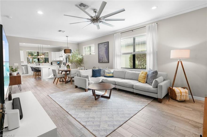 Did you think a beautiful pool home was out of reach? Think again. Experience refined Florida living in this impeccably maintained 2-bedroom + den, 2-bath residence, built in 2017 and perfectly positioned on a quiet cul-de-sac within an exclusive gated community. Offering modern open-concept design and exceptional upgrades throughout, this home seamlessly blends comfort, elegance, and privacy.  Step inside to discover a freshly painted interior enhanced with crown molding, updated hardware, designer light fixtures, new faucets, and contemporary ceiling fans. The thoughtfully designed split-bedroom floor plan ensures maximum privacy, while the versatile den provides the flexibility for a sophisticated home office, media room, or easily converted third bedroom.  At the heart of the home, the chef-inspired kitchen features an expansive island ideal for entertaining, complemented by a full appliance suite including range, microwave, dishwasher, and refrigerator. The kitchen flows effortlessly into the spacious living and dining areas—perfect for gatherings both intimate and grand.  Outdoors, your tropical paradise awaits. The screened-in lanai showcases a heated saltwater pool with tranquil water feature, all overlooking serene lake views. Unmatched Resort-Style Amenities:  Residents enjoy a gated community with a grand clubhouse, state-of-the-art fitness center, two luxury-style pools, spa, tennis, pickleball and bocce courts, fire pit, tiki bar, BBQ area, and scenic sidewalks throughout. Optional membership to the nearby Summerset Golf Course—its sister community—further enhances the lifestyle with expanded social and sporting opportunities.  Prime Southwest Florida Location:  Conveniently located just 16 minutes from Southwest Florida International Airport in Fort Myers, and moments from premier shopping and dining including Miromar Outlets and Whole Foods Market. Fine restaurants, malls, and everyday conveniences are all within easy reach.  This exceptional property offers the perfect balance of luxury, security, privacy, and accessibility—an extraordinary opportunity to embrace the very best of the Southwest Florida lifestyle.