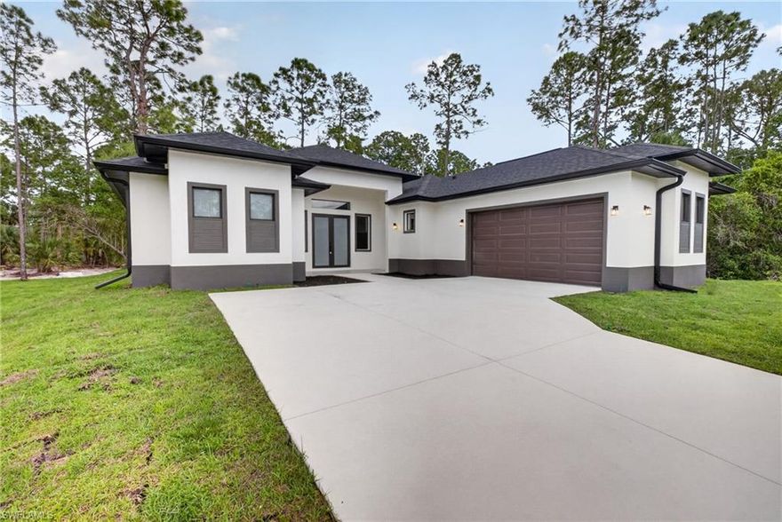 Brand new construction pool home situated on a spacious oversized lot in a quiet area of Lehigh Acres. This 4-bedroom, 3-bath residence features a modern open-concept layout with high tray and volume ceilings, wood-look tile flooring throughout, and abundant natural light. The kitchen is equipped with quartz countertops, a large island, white shaker cabinets, and stainless steel appliances, perfect for both everyday living and entertaining. The primary suite offers dual vanities and a beautifully designed walk-in shower with floor-to-ceiling tile. Enjoy Florida living at its best with a screened-in lanai and private pool, ideal for relaxing or hosting. Conveniently located with easy access to major roadways, shopping, and dining while still offering privacy and space. for maintenance and lawn care not included please contact agent for more information.