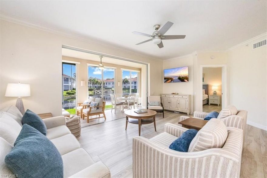 Nestled within the enclave of L’Ambiance in Pelican Bay, a remarkable Naples beach and tennis community, this first-floor end unit garden home has wonderful natural light and magnificent, sparkling waterscape views. This two-bedroom home boasts a renovated light and bright kitchen and bathrooms. A split bedroom floor plan for privacy, a spacious kitchen, and an enclosed lanai with sliding glass doors that allow flexibility for an additional 170 square feet of indoor living space or open-air outdoor space. Electric shutters on the lanai, impact glass and sliders provide peace of mind. Pelican Bay offers amenities to include exclusive beachfront restaurants, fitness and wellness centers, active tennis, newly completed pickleball and a wide variety of organized social gatherings and events all year long.