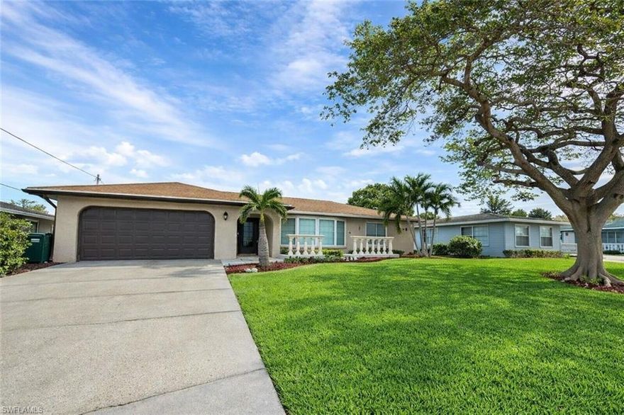 This beautifully renovated 3 bedroom, 2 bath home located in Cape Coral.
The backyard is designed for entertaining and relaxation, featuring a stunning custom pool finished in PebbleTec, surrounded by more than 1,200 square feet of elegant travertine decking, plus a spacious storage shed.
Step through the striking coffered entry ceiling and experience a beautifully redesigned interior porcelain tile flooring, custom mosaic feature wall detailing, crown molding, 5-inch baseboards, and upgraded wood casing around the living room window, sliding glass doors, and primary suite French doors. LED recessed lighting, and ceiling fans.

The chef-inspired kitchen is the centerpiece of the home, highlighted by a massive 126-inch custom island topped with exotic granite. Additional features include white shaker cabinetry, a Samsung convection slide-in range with vent hood, a travertine stone backsplash, and a custom wine bar equipped with dual wine racks.

Both bathrooms have shaker-style vanities, granite countertops, and wood-plank style shower walls accented with mosaic inlays. The primary suite offers dual sinks and a semi-frameless glass shower enclosure for a spa-like experience.
