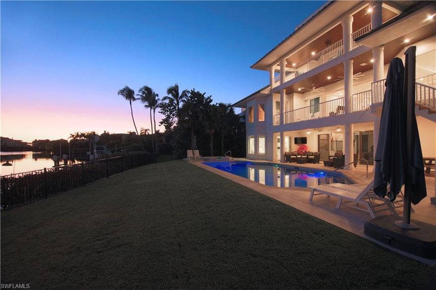 PRICE REDUCTION!! This fully renovated GRAND Key West style home is available for purchase. The interior/exterior spaces of this fabulous home were gut renovated in 2017-2018 with no detail spared. Features include 2 master bedrooms, impact windows and doors, spray foam insulation, hardieboard siding, boat dock with lift and jet ski dock, Wiring for Tesla/ev charger, speakers throughout the house, steam shower, jetted tub, safe, tongue and groove living area ceiling, huge open kitchen and living room, led lighting, iPad control panels, Kohler Numi automatic toilet, mosquito misting system, nest thermostats, custom cabinetry, thermador appliances, double dish washer, double oven, his and her office, master and living room area surround sound audio systems, huge pool at almost 50 feet long with spa and LED lighting...just to start!!! Two huge 10 foot islands with bar seating, an open floor plan, the latest home technologies, and separate levels for you and your guests. Conveniently located in Barefoot Beach you are just a few steps to the world famous beach. Or take the boat from your private dock and reach the gulf in minutes. UPDATE...Complete dock renovation complete June 2020!!!