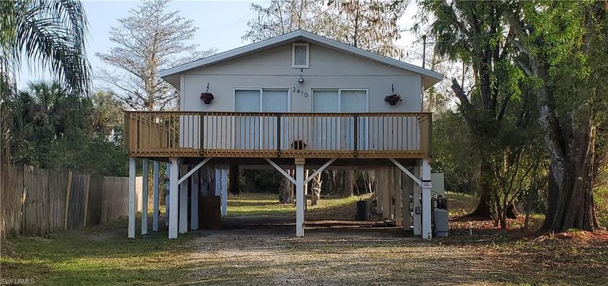 Currently the lowest priced home in all of Golden Gate Estates.  This home has been completely updated with new roof, new interior and exterior paint, new kitchen, updated bathroom, new granite countertops, new stainless steel appliances, new wide plank vinyl flooring, new fans and new lights.  The home has crown molding throughout.   The lower level is completely open for tons of storage or parking.  There is a large deck for entertaining, newer windows, 3 year old a/c system, newer hot water heater, and brand new whole house R/O system.  Won't Last.