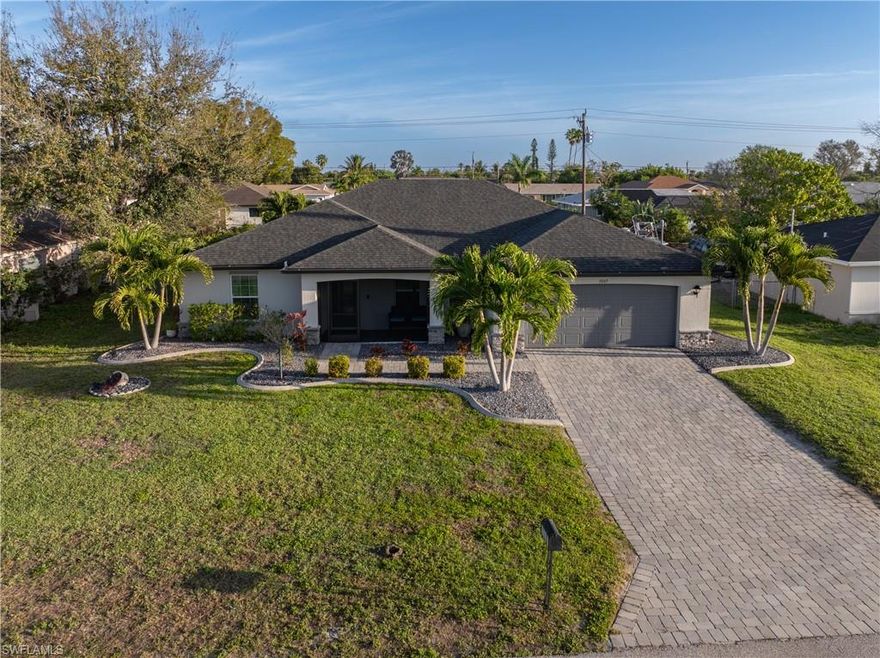 Welcome to this beautifully upgraded “St. Augustine” floor plan home located in desirable SE Cape Coral, where modern finishes and Florida lifestyle come together seamlessly.

This spacious 4-bedroom home features an inviting open-concept layout with soaring cathedral ceilings, creating a bright and airy living space perfect for both everyday living and entertaining. The center island kitchen is a standout, offering granite countertops, 36” upper cabinets with soft-close doors, and a full stainless steel appliance package, making it as functional as it is stylish.

The expansive living room flows effortlessly to the large screened lanai, where you can relax and enjoy the Southwest Florida lifestyle year-round. Step outside to your private backyard oasis featuring a saltwater pool, complete with a new pool pump (2025) and new pool lighting (2026)—perfect for evening swims and entertaining.

Additional upgrades and features include:

*PGT Low-E insulated windows

*Luxury vinyl plank flooring in all bedrooms (2025)

*18” tile throughout main living areas

*Fresh interior and exterior paint (2026)

*New refrigerator (2025) & dishwasher (2024)

*Lanai hurricane shutter (2025)

*Epoxy-coated garage floors & electric garage door opener

*Stone accents on the front elevation for added curb appeal

*Irrigation system to keep your landscaping lush

This home offers the perfect blend of comfort, style, and peace of mind with numerous recent updates already completed. Whether you're looking for a full-time residence or a seasonal retreat, this move-in-ready property checks all the boxes.

Don’t miss your opportunity to own a piece of paradise in Cape Coral!