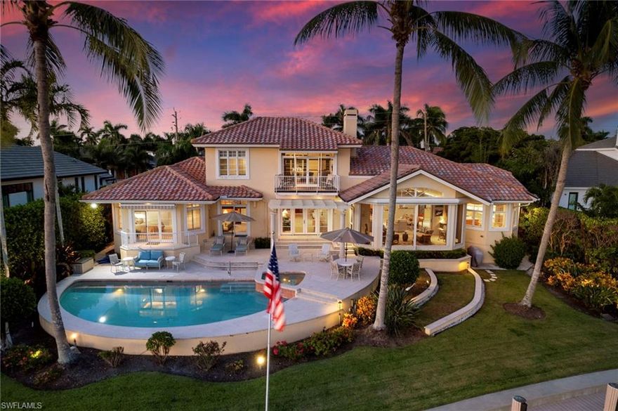 H9605. Gorgeous waterfront home on Hurricane Harbor in The Moorings - just .8 mile to the private Moorings Beach! Enjoy the delightful wide bay southern exposure views from every room & sunset from the Moorings Beach! Built by renowned Frontier Custom Homes, this is a solid one owner custom 3 bedroom, 3.5 bath home plus office, providing one level living on the first floor & plenty of room for guests.  The pride of ownership shines through with a welcoming design that begins at the paver driveway and continues as you enter the foyer with a 20’ vaulted ceiling, grand staircase and balcony, sporting unobstructed water views. The style of the home is a seamless blend of elegance, tropical warmth, and traditional touches. Entertaining and cooking is a pleasure in the updated kitchen with large island, bar, wine cellar & walk in pantry. Take your choice to sip morning coffee from the breakfast nook, lanai or pool deck as you overlook the bay and swaying palms! The second floor includes a loft living area, bedroom, full bath and relaxing balcony overlooking the private dock & harbor. This is truly your own self-contained resort and yet super close to all amenities. Explore a short boat ride to the Gulf of Mexico via Doctors Pass, known as a fisherman’s delight.  Come see this amazing home and make it yours today!