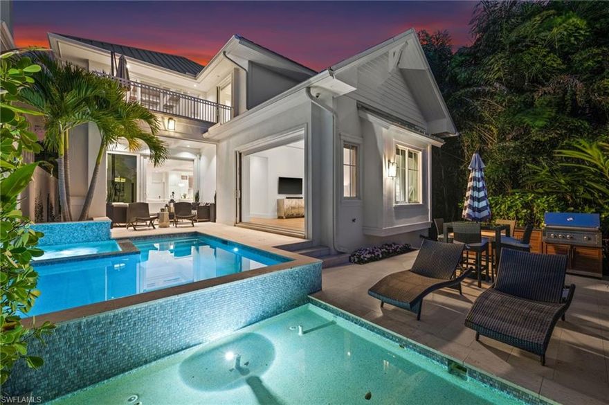 Welcome to 770 Park St., with a superb location just steps from the heart of 5th Avenue South's world-class dining and shopping and the pristine powder sand beaches of Naples. A polished property exuding sophisticated elegance throughout with an inviting open feel and brightness. Walk into a home of timeless, upscale charm and step out into a world of ease in the Naples coastal lifestyle surrounded by bike riders and dog walkers galore, tennis playing across the way, with the holiday tree lighting at the end of your street. This modern coastal gem thoughtfully designed by Lotus Builders and MHK Architecture is a private and peaceful retreat with a master bedroom downstairs facing an impressive outside pool space and flowing water feature wall. A chef's envious oversized kitchen has a gas six burner stovetop, double oven and custom stove hood. The top of the stairs landing has a delightful and fun loft room great for entertaining with a wow factor open to below showcasing twenty feet high ceilings. Three en-suite bedrooms with custom built in walk in closets finish off the upstairs layout for family and guests. A lake sits directly behind the home so nothing will be built behind this residence, guaranteeing fabulous west sunset views daily over The Gulf. Take in these stunning views or sunbathe from the upstairs west facing balcony.  An entertainer's dream home awaits the most discerning buyer seeking a full-time residence, seasonal escape, or investment opportunity. 770 Park Street places you close to everything that makes Naples exceptional, while still offering a peaceful and private residential setting. This is Florida living at its best, effortless and undeniably inviting.